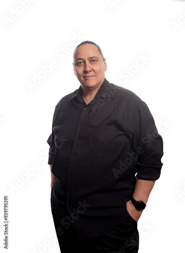 Adult man, an adult man in black clothing in front of a white background, selective focus.