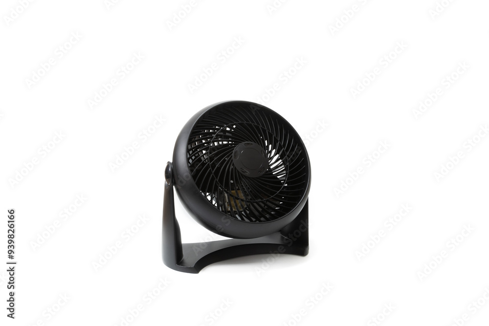 A black table fan, isolated on a white background. Warm, summery, cool, eco-friendly, modern. A black table fan, isolated on a white background. Warm, summery, cool, eco-friendly, modern.
