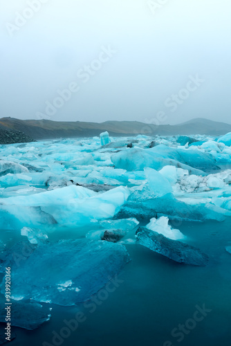 Floating iceberg of the Jokulsarlon Glacier Lagoon under heavy rain with the fog,  Iceland