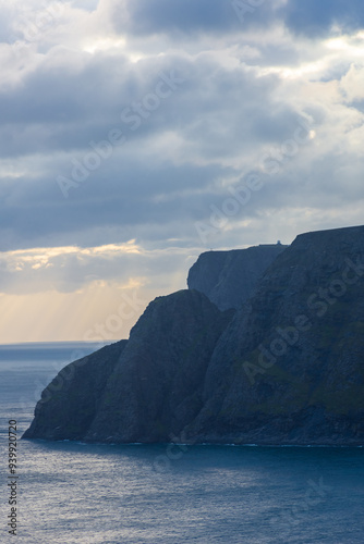 Beautiful sun beams over the North Cape cliff and the Arctic Ocean,  Norway photo