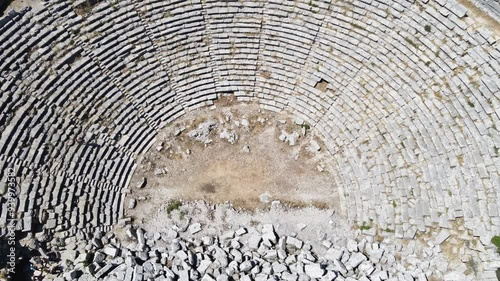 The scenic views of the ancient theater of Selge, which was an important city in ancient Pisidia and later in Pamphylia, on the slope of Mount Taurus, Antalya, Turkey photo