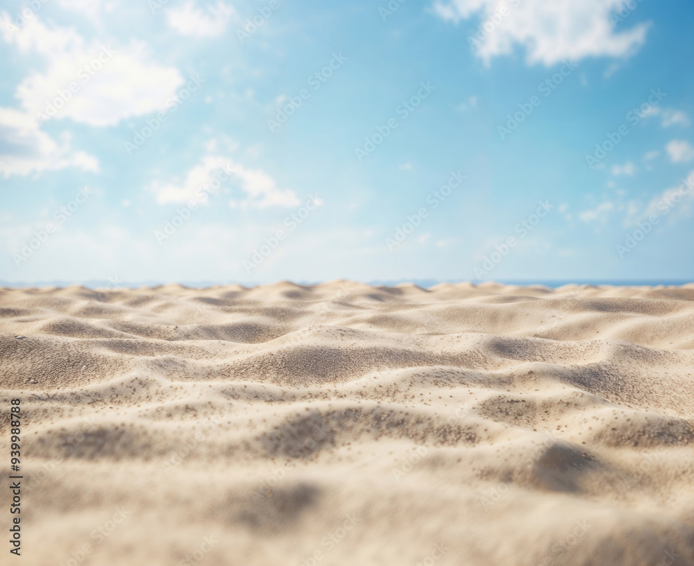 Tropical beach with sand, ocean, and blue sky in the background Tropical beach with sand, ocean, and blue sky in the background