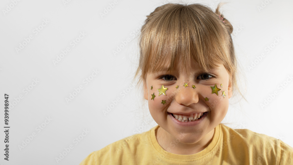 Smiling little girl with stars painting on cheeks mockup Smiling little girl with stars painting on cheeks mockup
