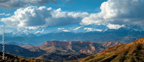 Stunning mountain landscape with snow-capped peaks under a vivid sky, showcasing the beauty of nature and serene outdoor scenery.