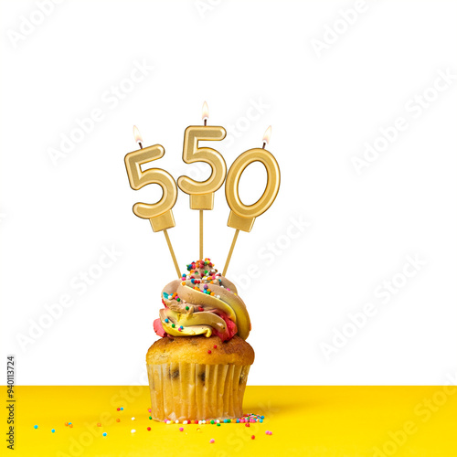 Birthday candle number 550 - Cupcake on white background photo