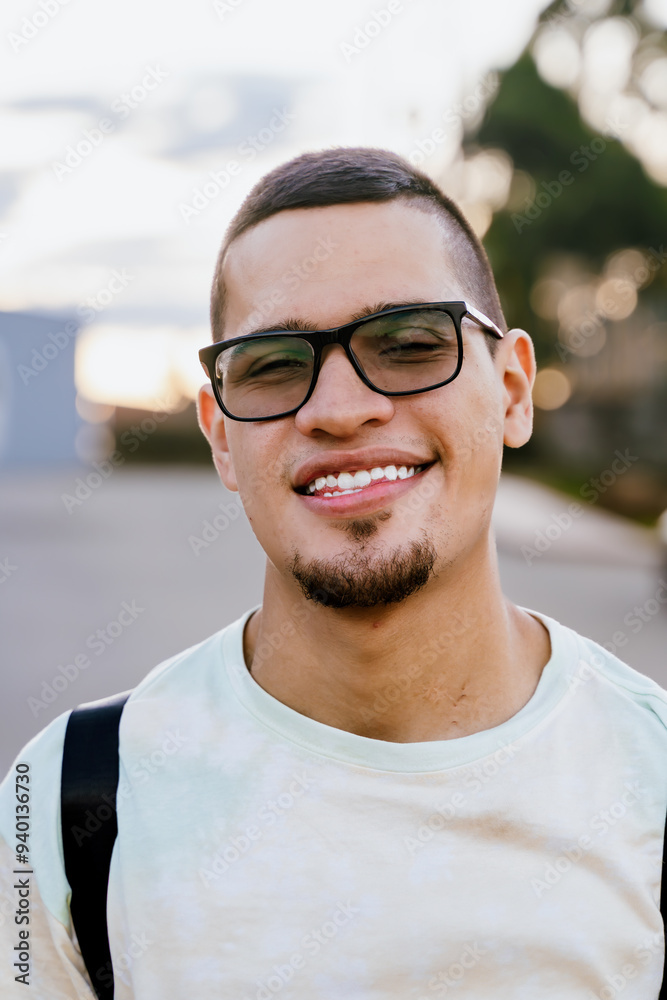 Man traveling with dark glasses smiling, visiting villages in Colombia. People smiling. Travels and experiences.