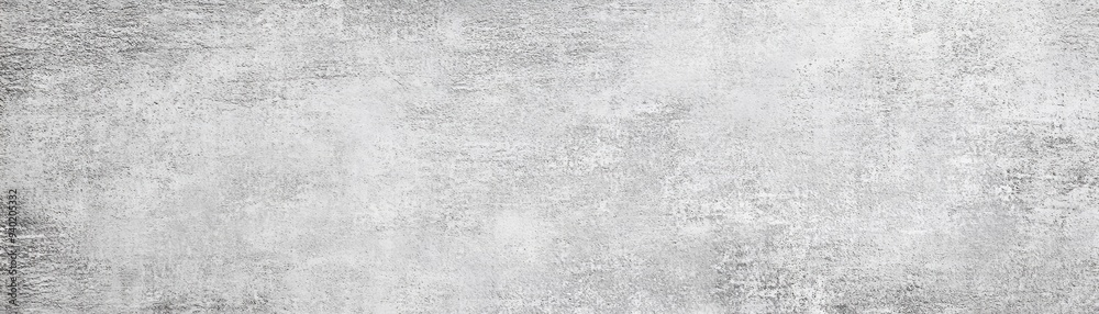 Abstract gray concrete background with a rough, textured surface.