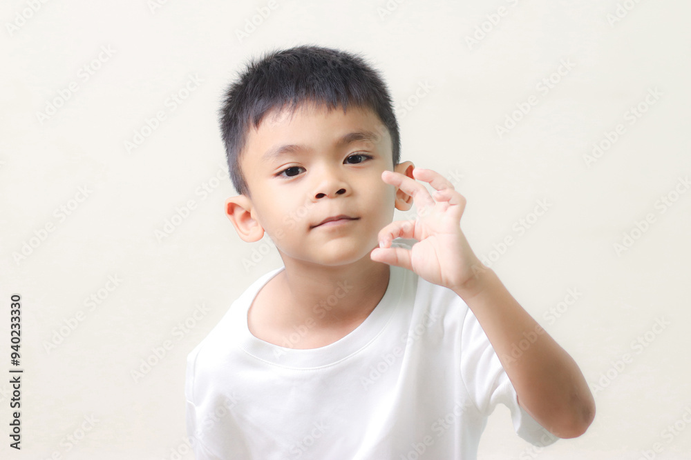 Image of Asian child posing on white background. Image of Asian child posing on white background.