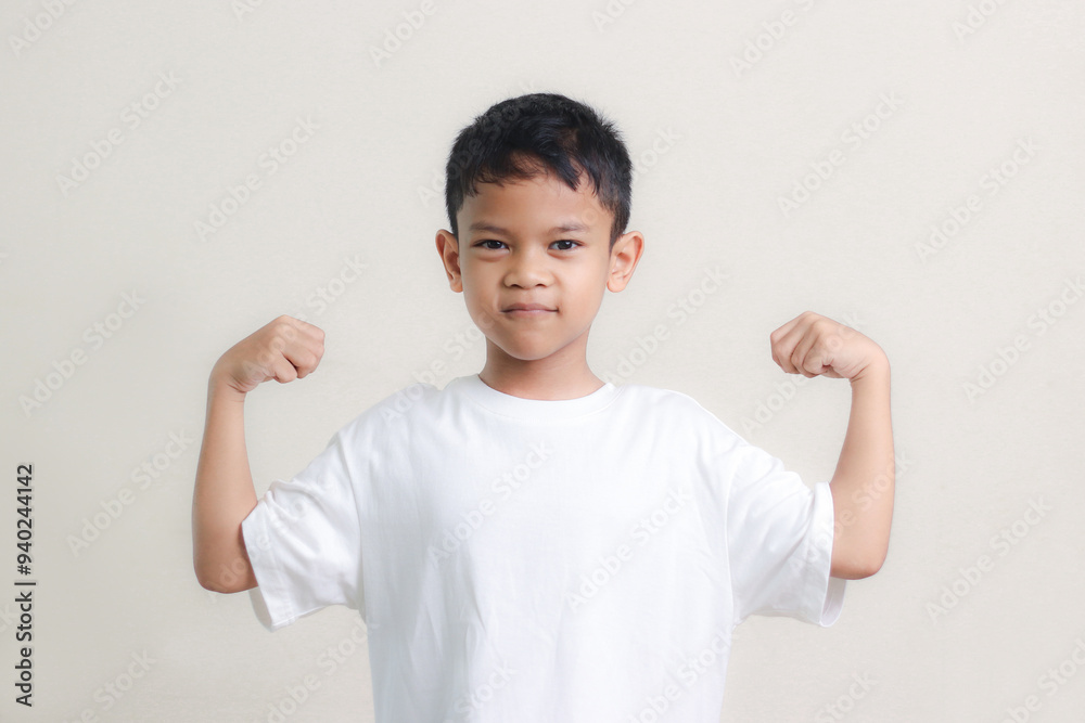 Happy Asian children showing her strong hands. Happy Asian children showing her strong hands.