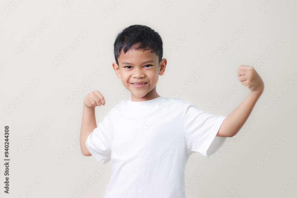 Happy Asian children showing her strong hands. Happy Asian children showing her strong hands.