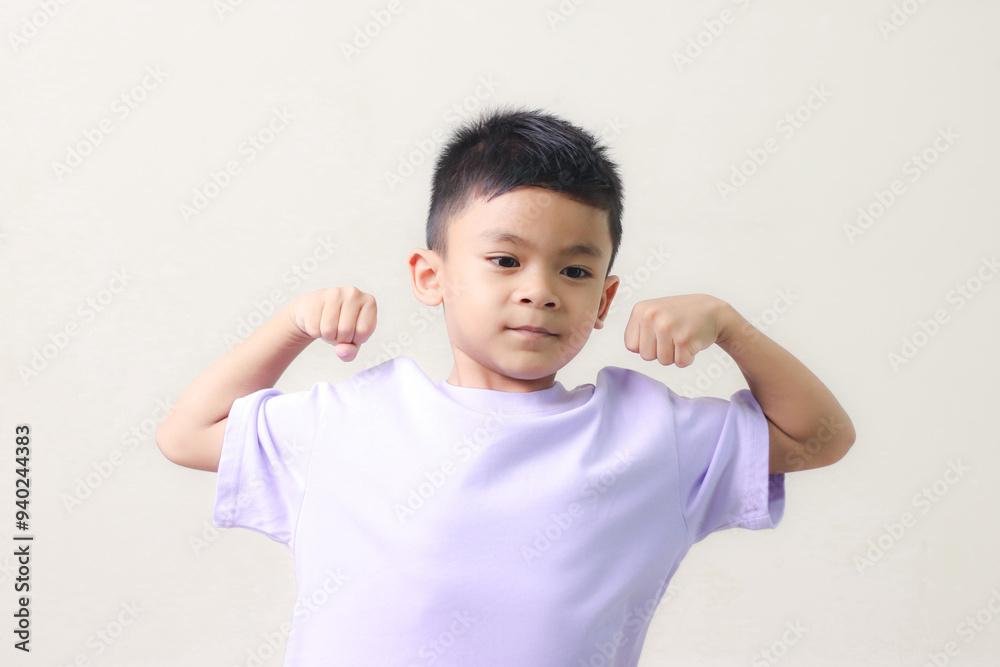 Happy Asian children showing her strong hands. Happy Asian children showing her strong hands.