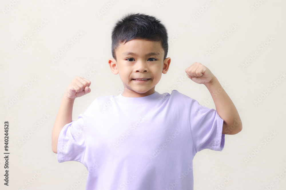 Happy Asian children showing her strong hands. Happy Asian children showing her strong hands.