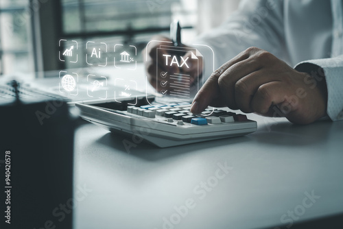 Businessmen using online personal income taxes payment calculators, and laptop computers to fill out tax refund forms. Calculation of personal and business income tax photo