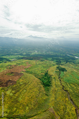 Aerial drone view of green savanna near Mount Sinabung at Berastagi in North Sumatra, Indonesia. photo