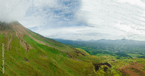 Aerial drone view of green savanna near Mount Sinabung at Berastagi in North Sumatra, Indonesia.