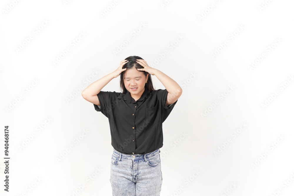 Young Asian woman suffering headache, hand on head wearing Black t-shirt and jeans isolated on white background Young Asian woman suffering headache, hand on head wearing Black t-shirt and jeans isolated on white background