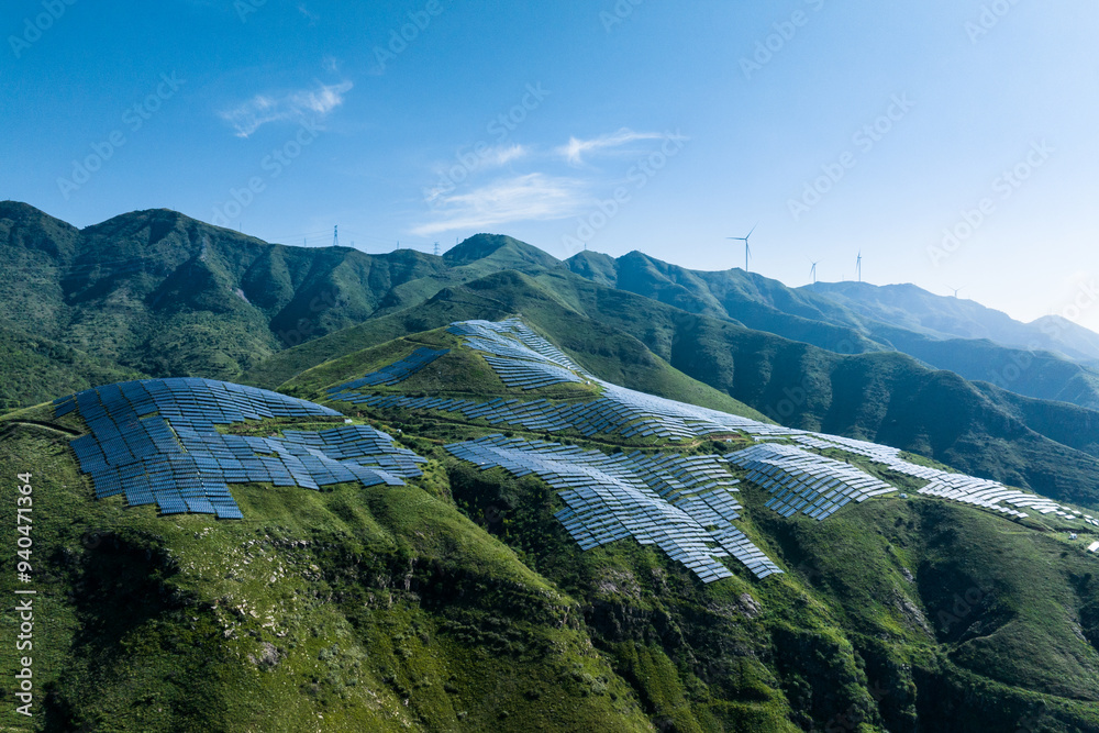 Obraz premium view of solar power station on green hill