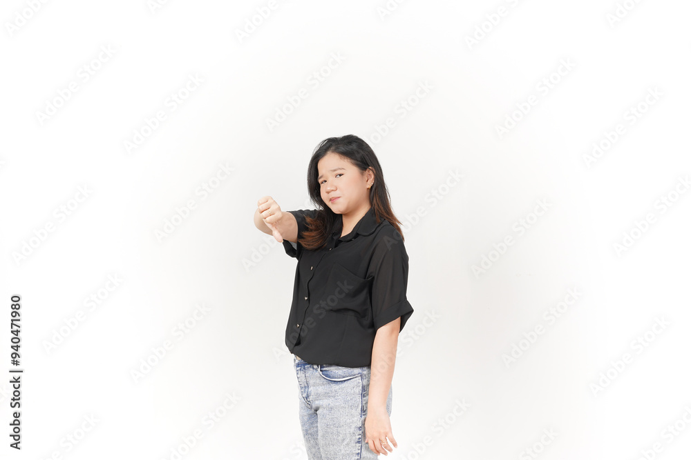 Young Asian woman showing thumbs down wearing Black t-shirt and jeans isolated on white background Young Asian woman showing thumbs down wearing Black t-shirt and jeans isolated on white background