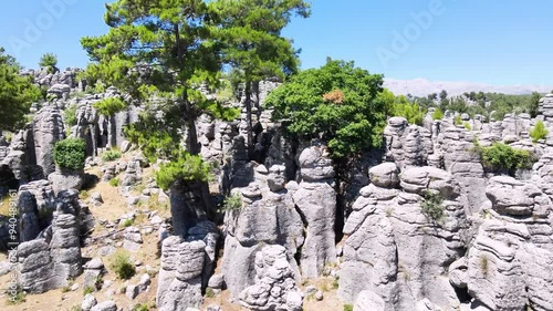 The area of conglomerates of rocks surrounding the ancient city of Selge in Antalya. The area called Avatar Land, named Rocks of Man, because it resembles a standing person, creates a fantastic image. photo