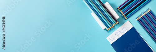 Notebook with math formulas paper and gradient blue pencil on the podium, Back to school, education concept. banner size