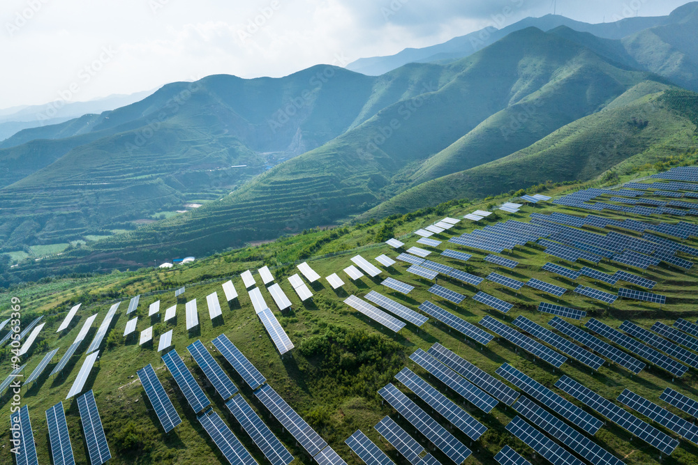 Fototapeta premium view of solar power station on green hill