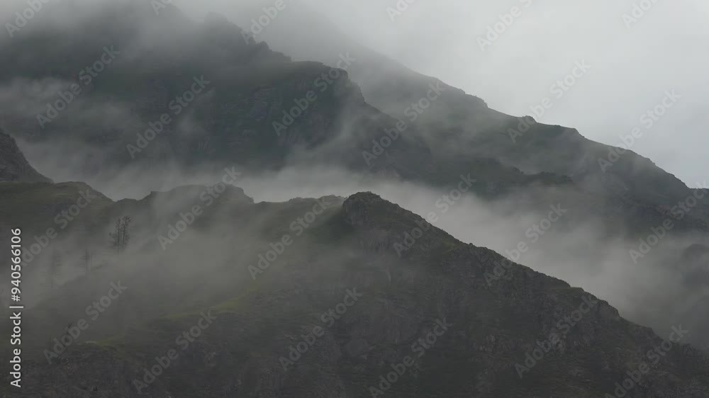 Time-lapse video of morning mist in the Altai mountains. Fog is floating over the slopes of mountain ridges. Ongudai region of Altai republic. Time-lapse video of morning mist in the Altai mountains. Fog is floating over the slopes of mountain ridges. Ongudai region of Altai republic.