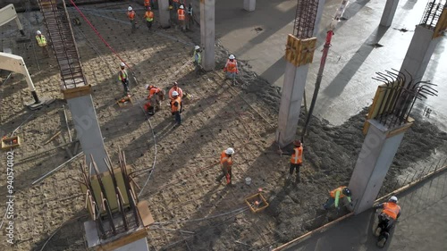 Construction Workers pouring Concrete