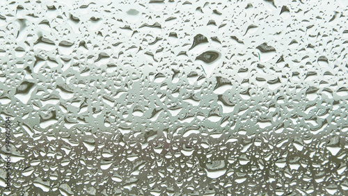 Water droplets sticking to the windshield in the rain photo