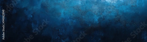 A textured dark blue abstract background with varying shades creating depth and interest, perfect for creative design projects.