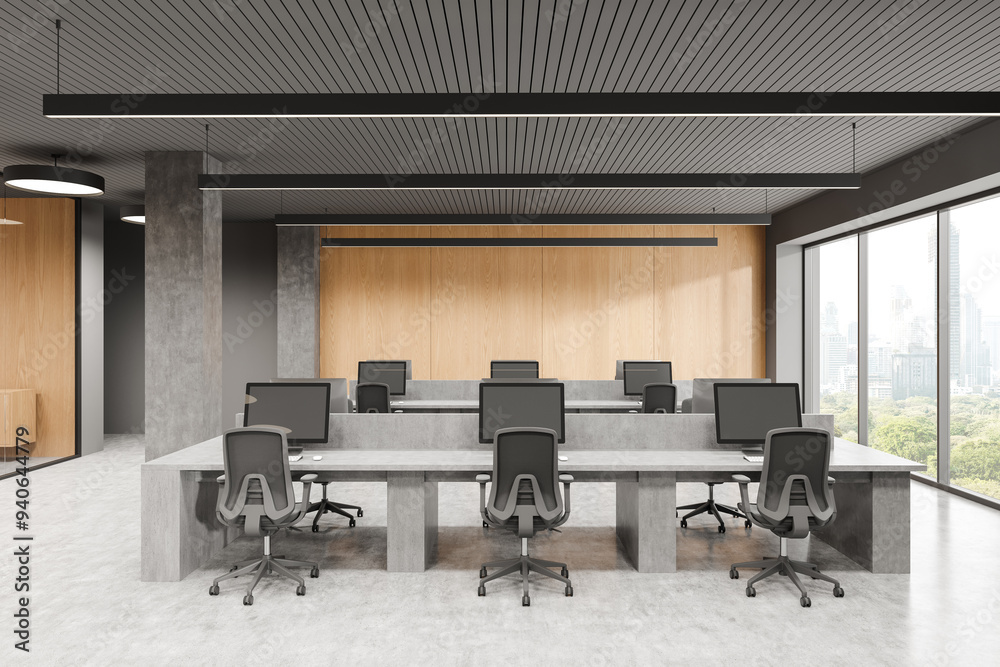 Fototapeta premium Coworking room interior with pc computers on stone tables, panoramic window