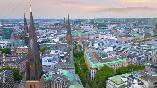 4K Aerial view revealing Hamburg Town hall and The Alsterarkaden (Die Alsterarkaden) , Kleine Alster , Hamburg , Germany photo