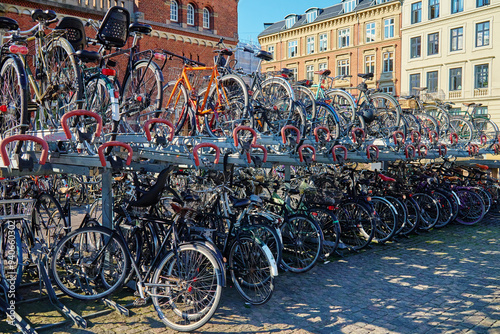 Canvas Print Many bicycles parked at a public bike rack in Copenhagen