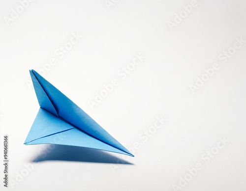 Blue paper plane origami isolated on a blank white background. Ai generated image