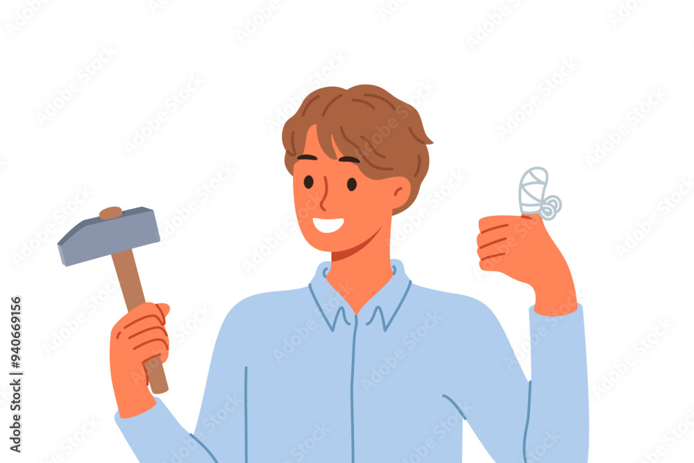 Man injured finger using hammer to drive nail, shows thumbs up and reports that everything is OK. Young guy has finger injury with bandages applied to stop bleeding and avoid infection Man injured finger using hammer to drive nail, shows thumbs up and reports that everything is OK. Young guy has finger injury with bandages applied to stop bleeding and avoid infection