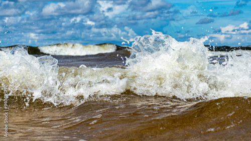 Fototapeta Naklejka Na Ścianę i Meble -  seascape, storm at sea, white waves crashing against the shore, Baltic Sea coast, Latvia