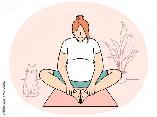 Pregnant woman making morning exercises sitting on fitness mats and getting ready for meditative practices from yoga. Pregnant girl is at home and stretches doing yoga for expectant mothers