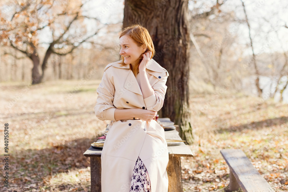 Smiling woman leaning on table in forest Smiling woman leaning on table in forest