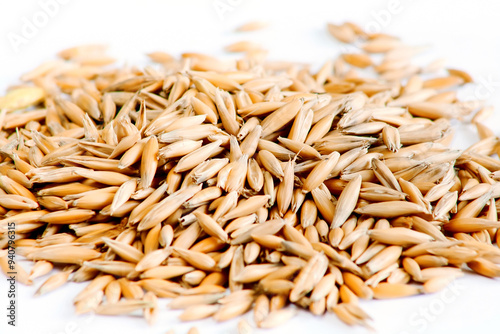 Oats, whole groats seeds close up