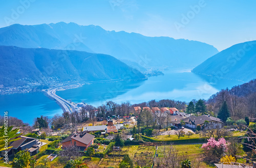 Obraz na płótnie Carona gardens behind Melide Causeway and hazy Alps, Ticino, Switzerland w salonie