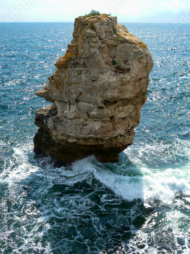 High impregnable rock in the water near the village of Tyulenovo in Bulgaria, Black Sea photo