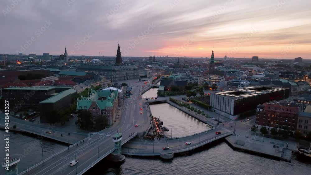 4K Aerial video of downtown Copenhagen in Denmark at sunrise. Christiansborg Palace. Aerial view of a vibrant Cityscape with a stunning bridge
