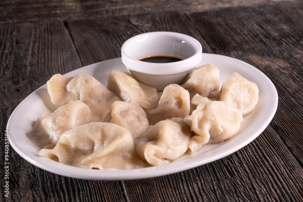 Chinese Dumplings on a wooden background. Food concept. Chinese food. Chinese Dumplings on a wooden background. Food concept. Chinese food.