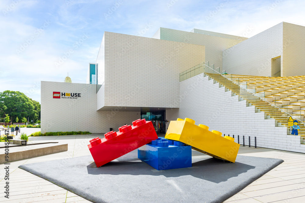 Obraz premium Billund, Denmark - July 14, 2024: Main entrance of the Lego House, home of the brick, a building designed by Bjarke Ingels Group and open in 2017 to showcase the brand's construction toys.