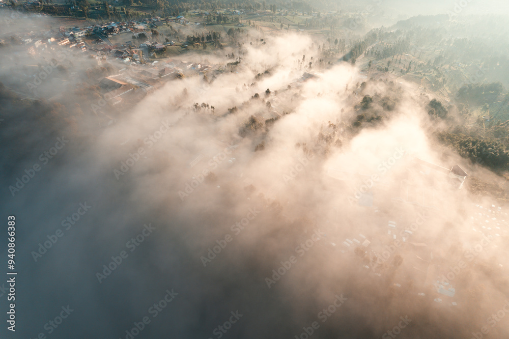 Aerial panoramic view of Indonesia's Bromo volcano and clouds at sunrise Aerial panoramic view of Indonesia's Bromo volcano and clouds at sunrise
