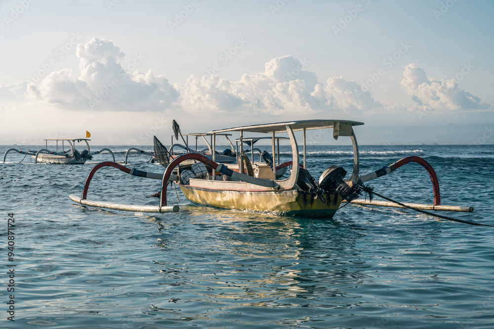 Fototapeta premium Close-up of local people's wooden boats on Lembongan Island in Bali, Indonesia at sunset
