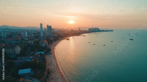 A drone shot of Pattaya city during the day, showing the harmony between the urban area and the natural coastline.