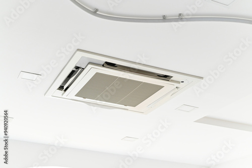 Ceiling-mounted air conditioning unit with modern design and sleek appearance..