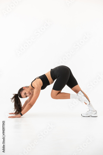 Smiling healthy woman doing yoga at home. white background