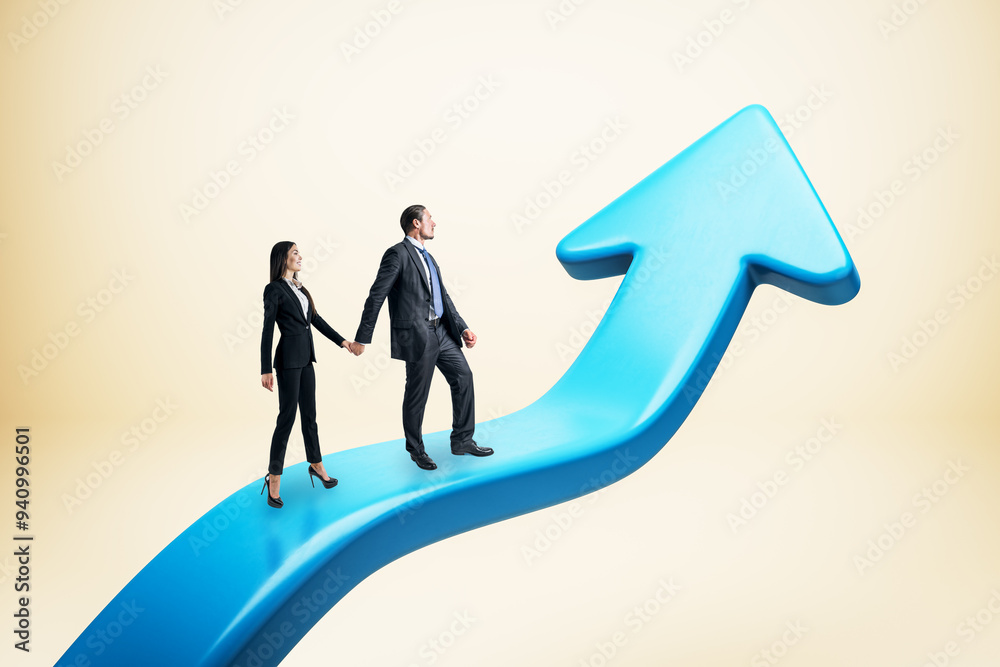 Young businesswoman and man standing on upward blue arrow. Light background. Growth and success concept. Young businesswoman and man standing on upward blue arrow. Light background. Growth and success concept.