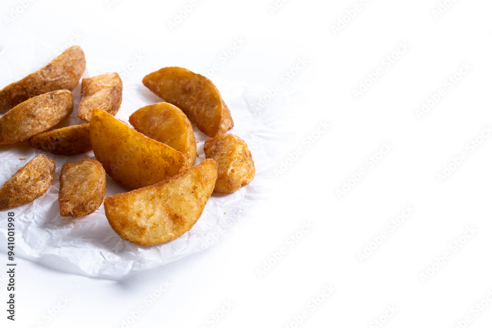 Fried potato wedges isolated on white background. Copy space Fried potato wedges isolated on white background. Copy space
